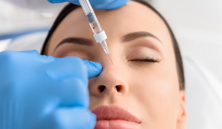 a medical professional learning a botox training course