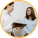 Clinician giving after-care instructions to their patient