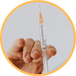 Person holding a needle and choosing the right size